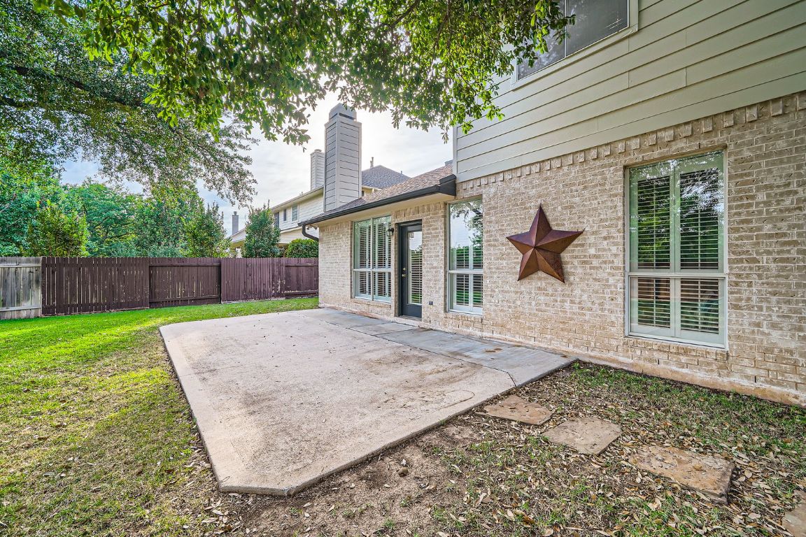 1237 Fall Creek Loop Cedar Park, TX 78613 - Photo 34 of 39 a view of a house with a yard and wooden fence