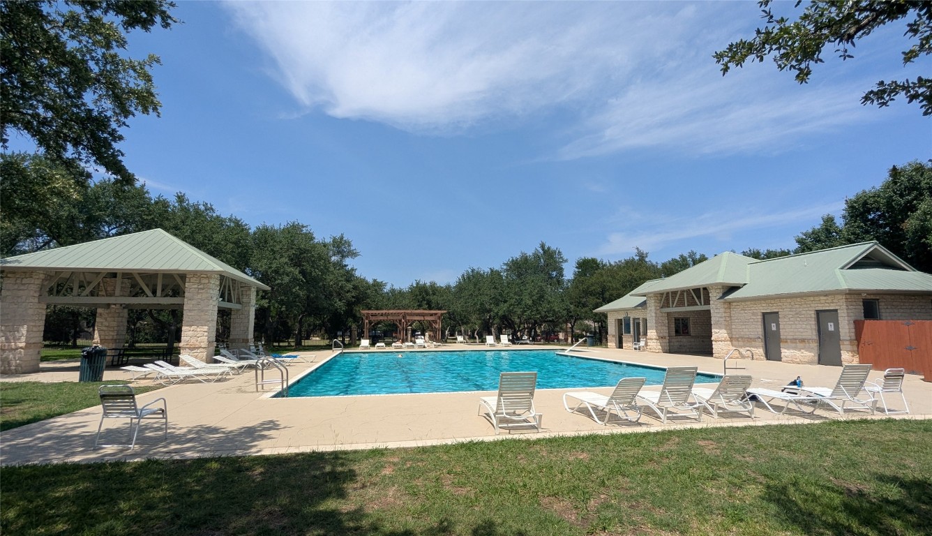 1237 Fall Creek Loop Cedar Park, TX 78613 - Photo 37 of 39 a view of house with yard and swimming pool