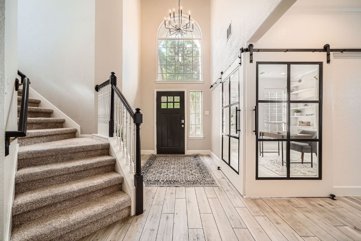 1237 Fall Creek Loop Cedar Park, TX 78613 - Photo 6 of 39 a view of staircase with white walls and a window