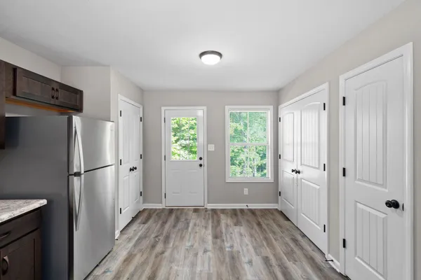 a view of a kitchen with a refrigerator a sink and dishwasher