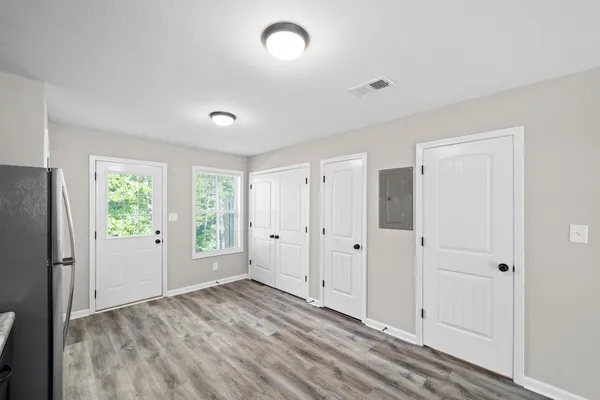 a view of an empty room with a window