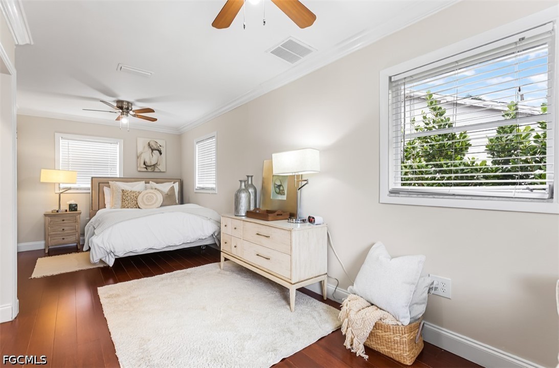 3950 Mohawk Place Naples, FL 34112 - Photo 12 of 25 a room with a bed and a chair