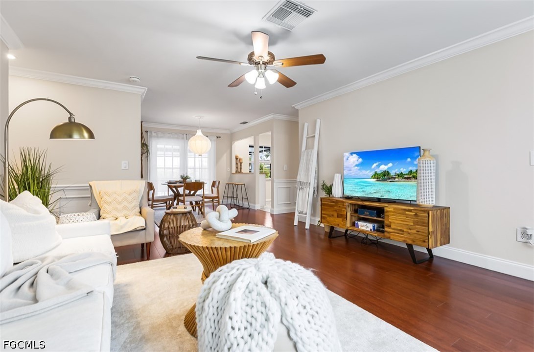 3950 Mohawk Place Naples, FL 34112 - Photo 4 of 25 a living room with furniture and a flat screen tv