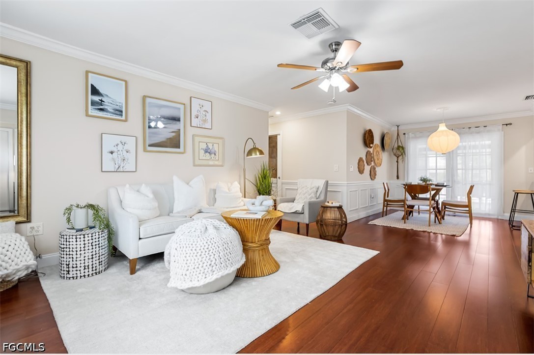 3950 Mohawk Place Naples, FL 34112 - Photo 6 of 25 a living room with furniture and wooden floor