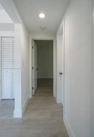 a bathroom with a granite countertop sink toilet and bathtub
