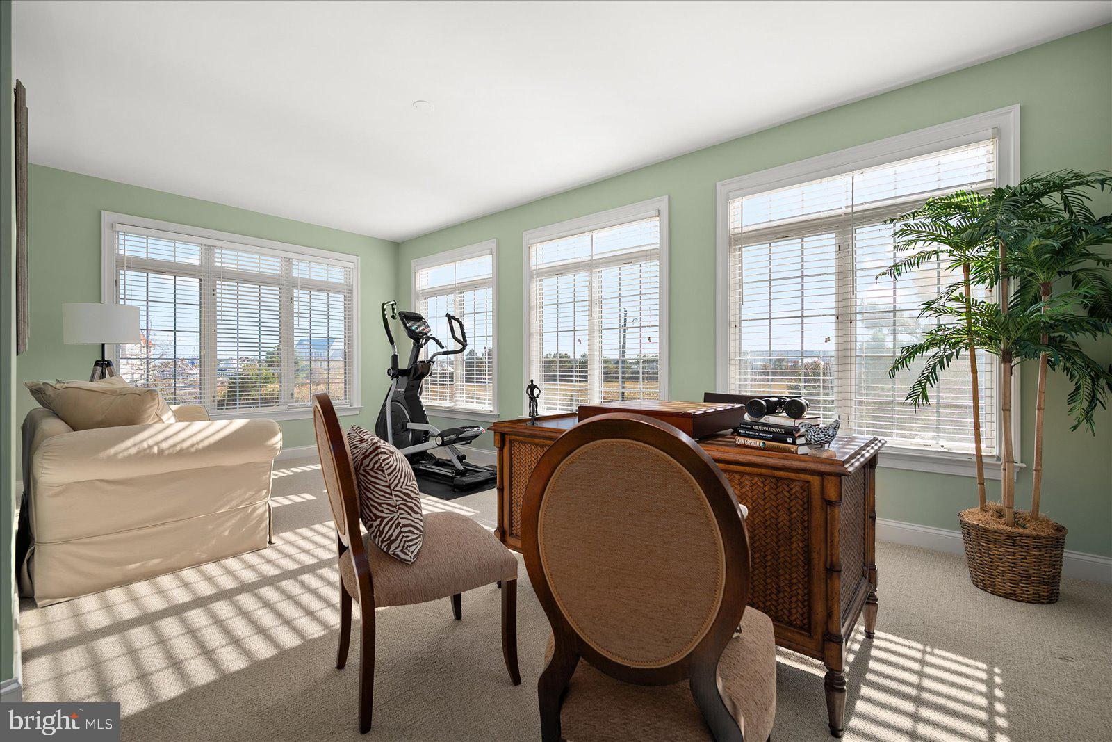 12901 Old Bridge Road, Unit PH8 2 Ocean City, MD 21842 - Photo 27 of 79 a bed sitting in a spacious bedroom next to a window