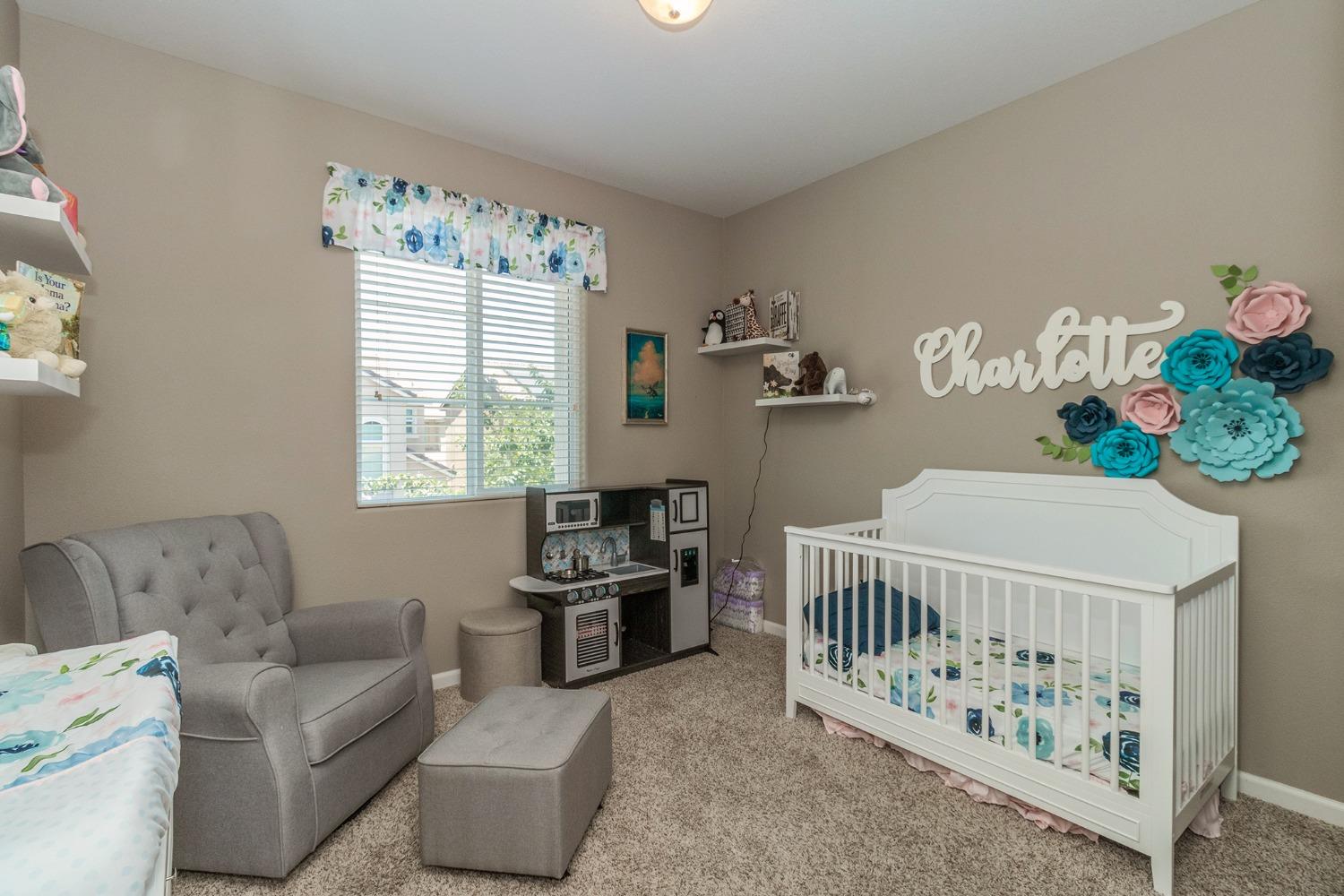 3263 Monviso Lane Clovis, CA 93619 - Photo 18 of 30 a bedroom with furniture and a window