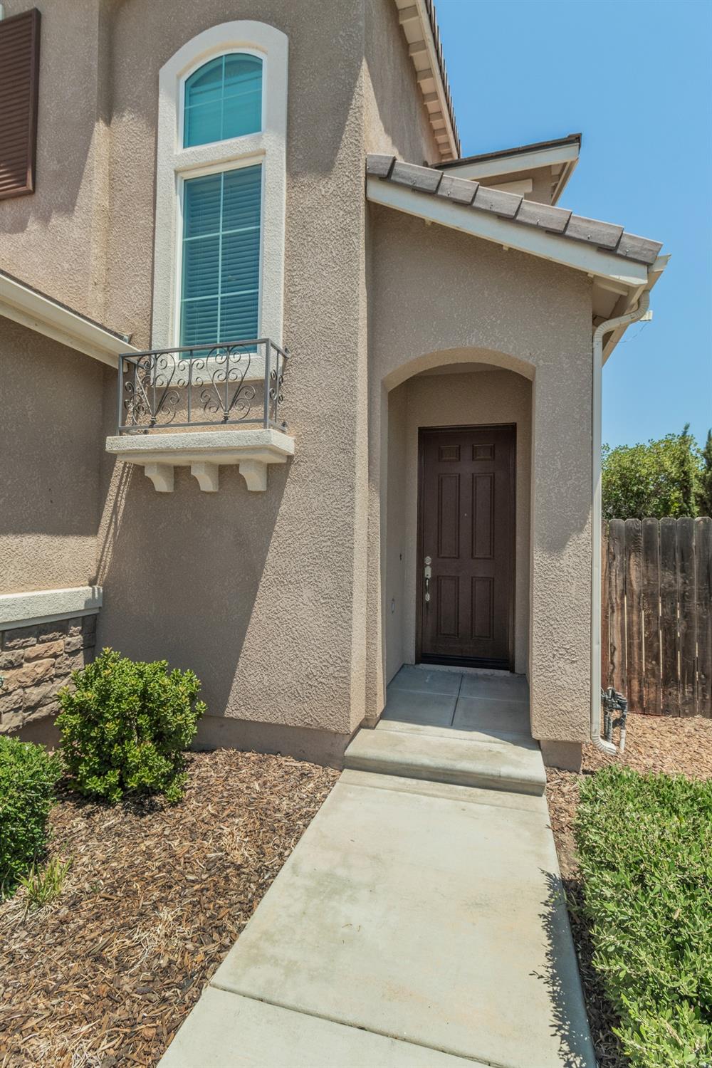 3263 Monviso Lane Clovis, CA 93619 - Photo 2 of 30 a front view of a house with a garage