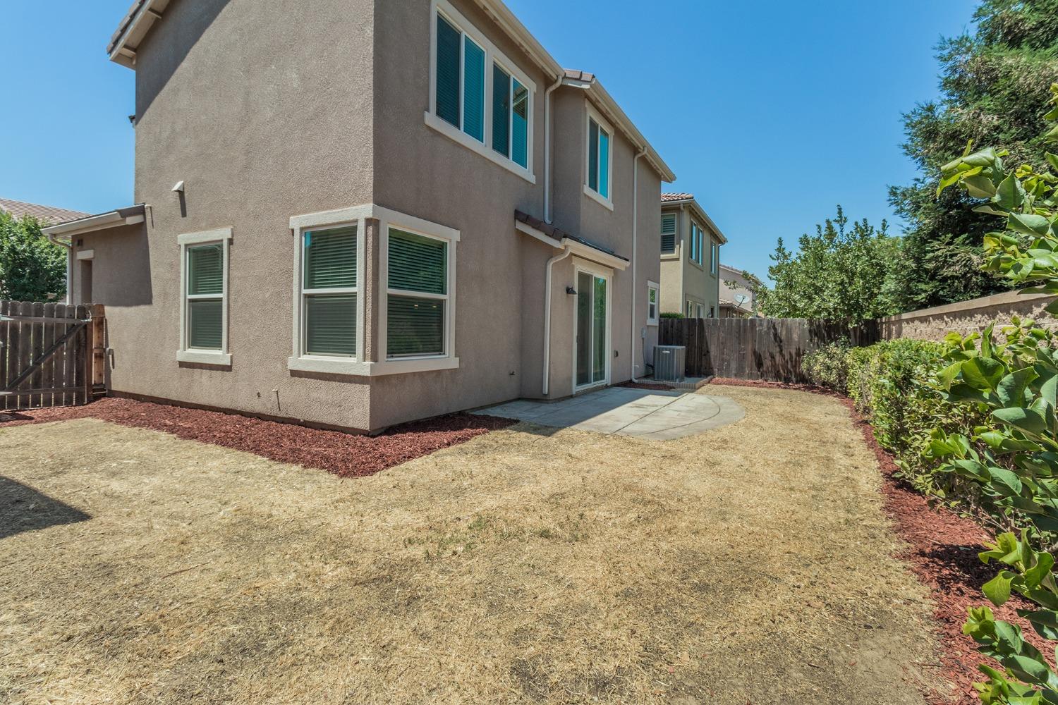 3263 Monviso Lane Clovis, CA 93619 - Photo 21 of 30 front view of a house with a yard
