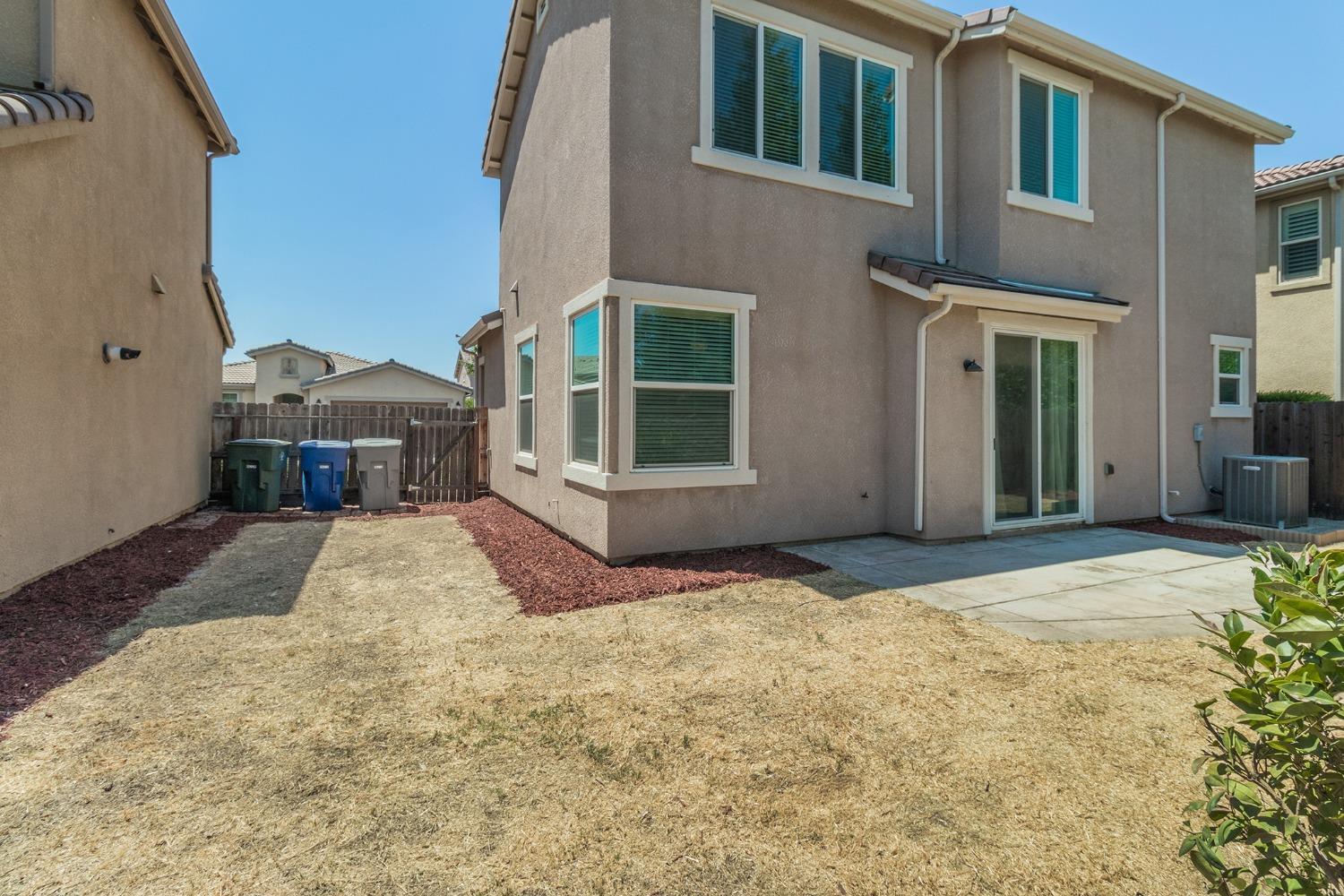 3263 Monviso Lane Clovis, CA 93619 - Photo 22 of 30 a view of a house with a yard