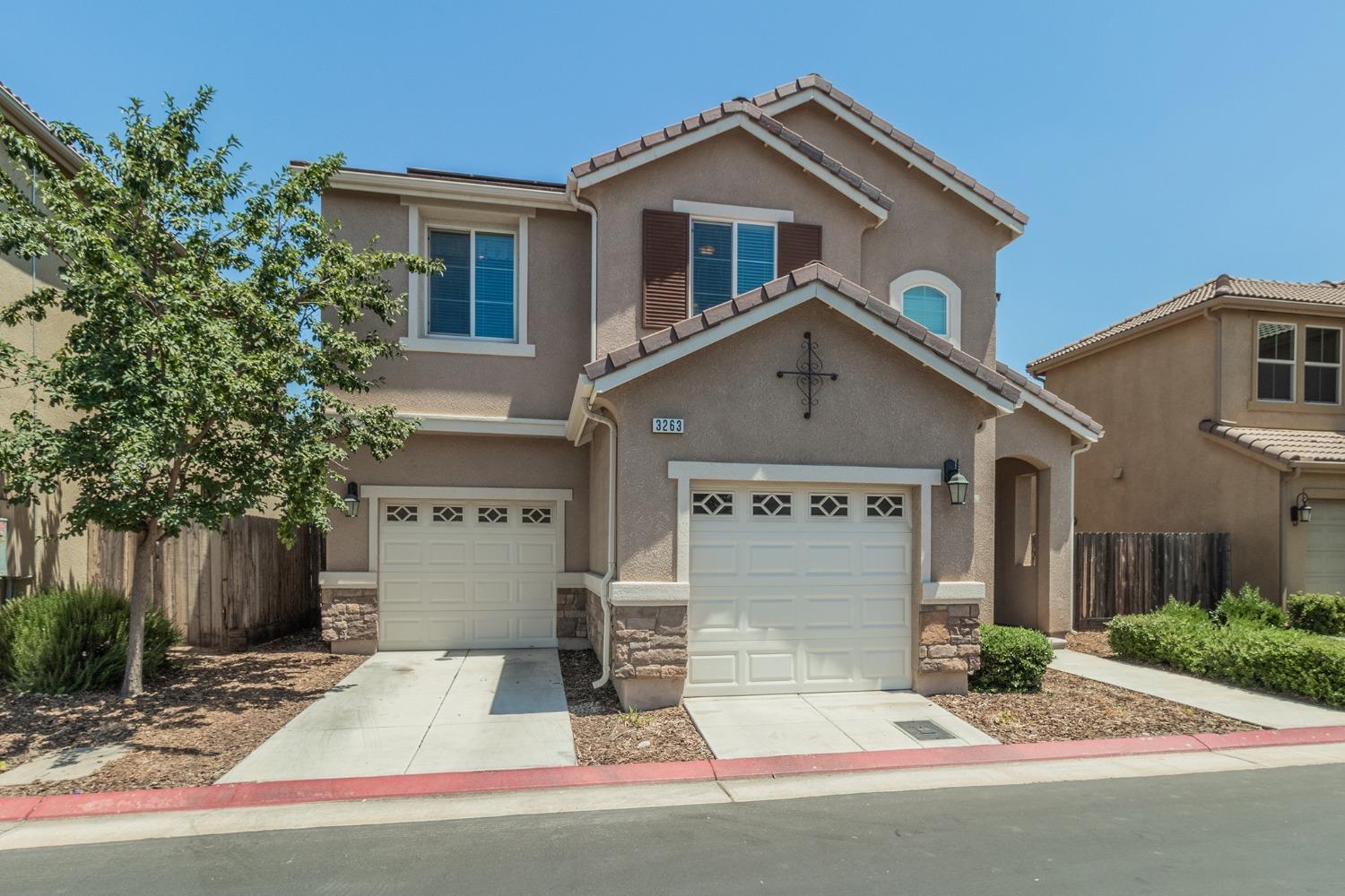3263 Monviso Lane Clovis, CA 93619 - Photo 24 of 30 a front view of a house with garden