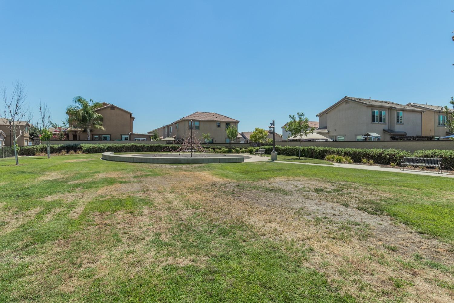 3263 Monviso Lane Clovis, CA 93619 - Photo 26 of 30 a view of a house with a yard and sitting area