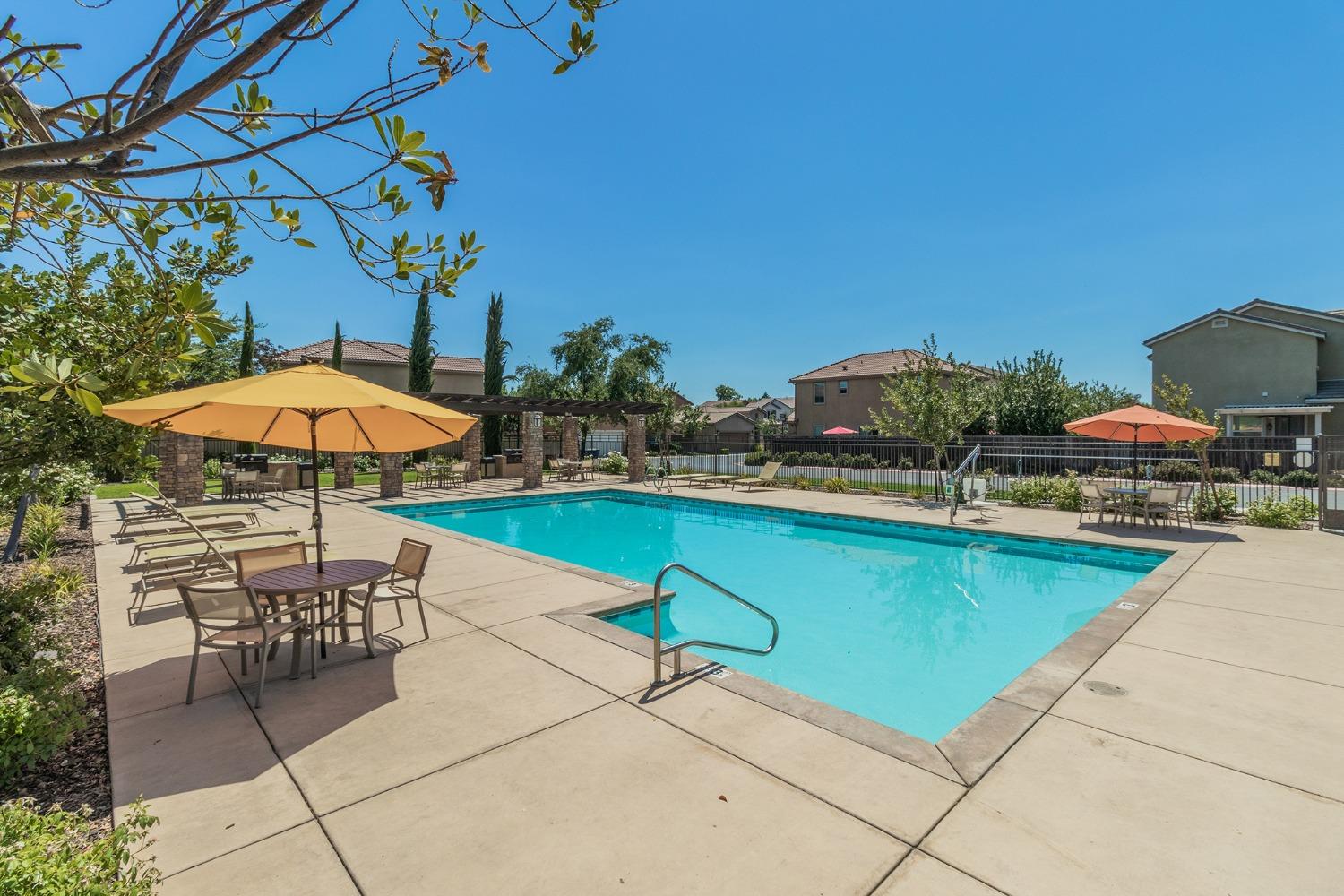 3263 Monviso Lane Clovis, CA 93619 - Photo 29 of 30 a swimming pool with outdoor seating and yard