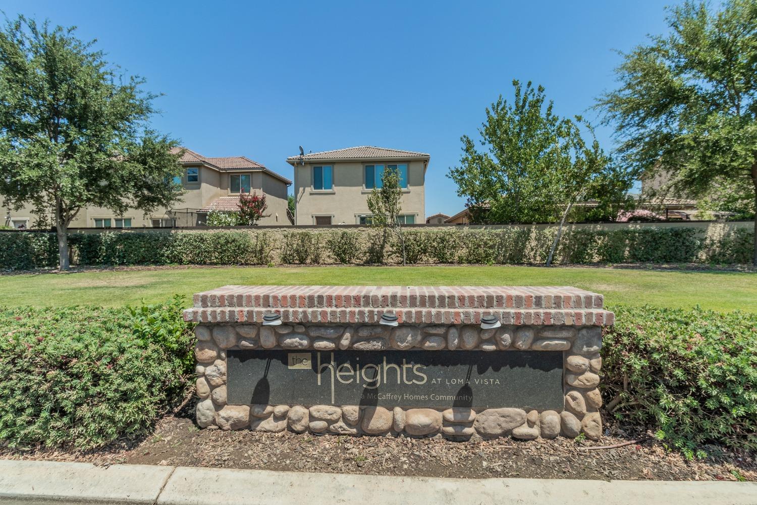 3263 Monviso Lane Clovis, CA 93619 - Photo 30 of 30 a view of swimming pool with a yard and plants