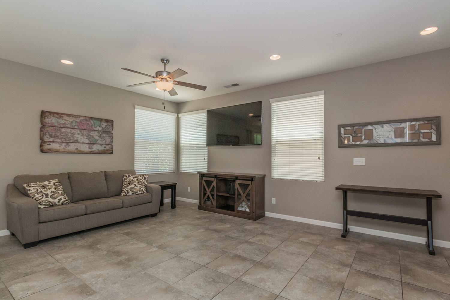 3263 Monviso Lane Clovis, CA 93619 - Photo 6 of 30 a living room with furniture and a fireplace