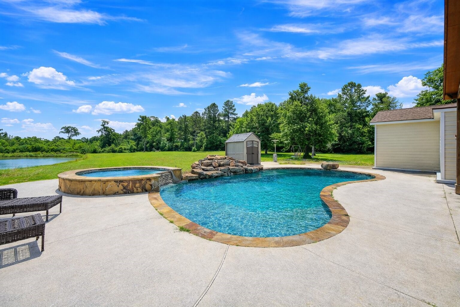 144 Wood Farm Road Huntsville, TX 77320 - Photo 28 of 35 a view of a garden with a swimming pool