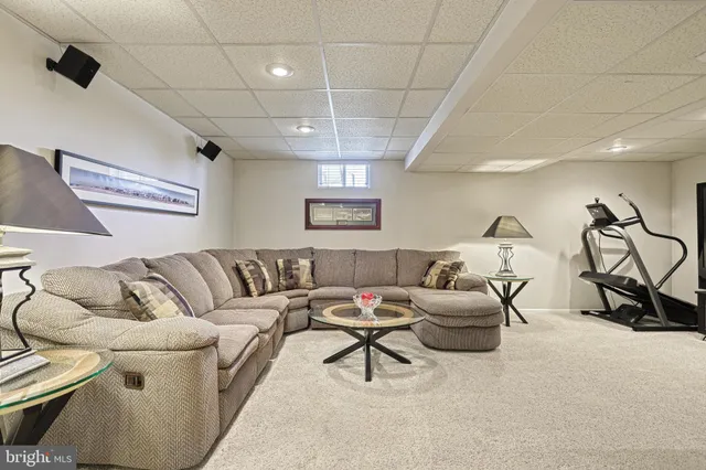 a living room with furniture and white walls