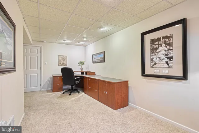 a view of workspace with painting on the wall