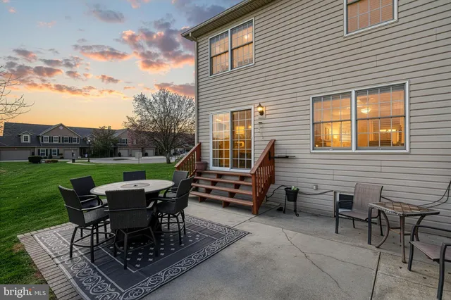 a backyard of a house with outdoor seating