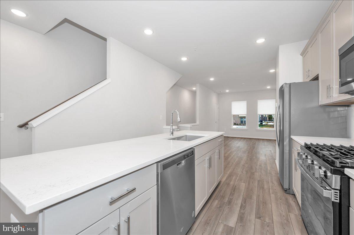 3357 Cormorant Drive Laurel, MD 20724 - Photo 13 of 41 a kitchen with a sink and a stove top oven