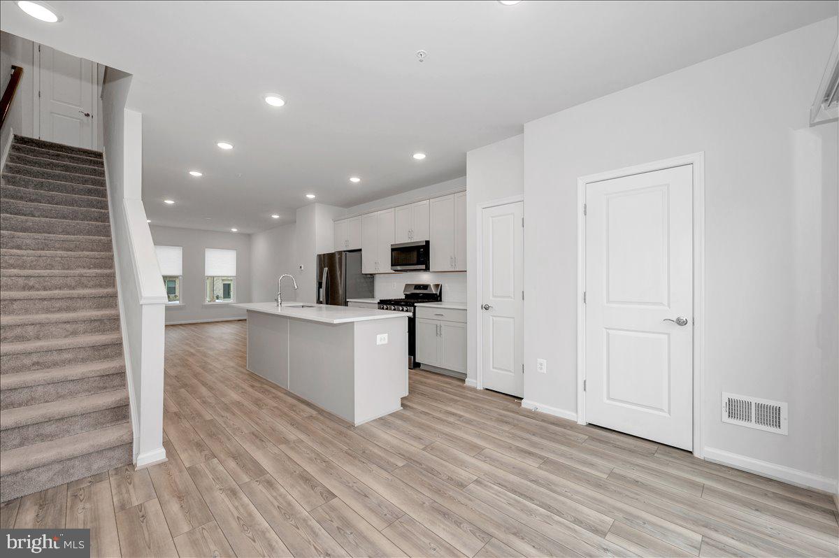 3357 Cormorant Drive Laurel, MD 20724 - Photo 19 of 41 a view of kitchen with refrigerator microwave and stove