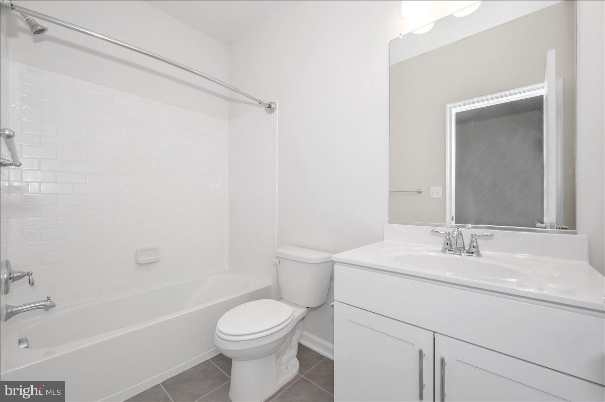 3357 Cormorant Drive Laurel, MD 20724 - Photo 34 of 41 a bathroom with a sink a toilet and shower