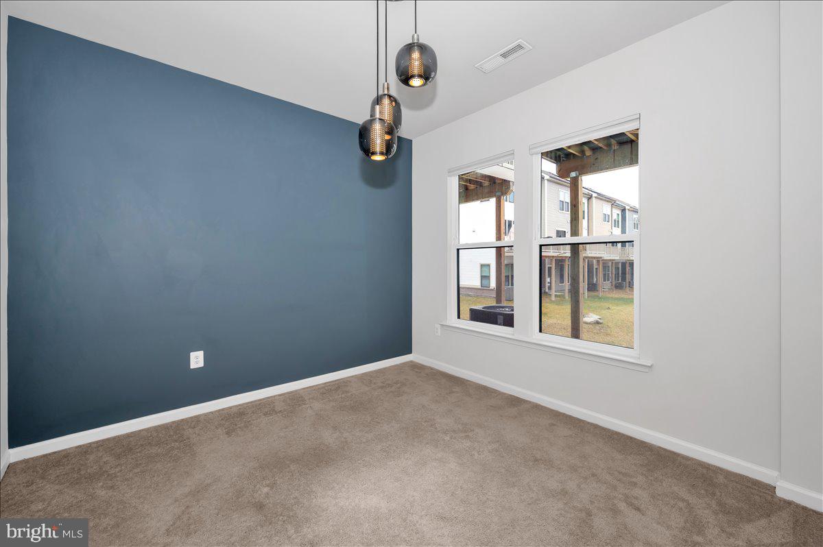 3357 Cormorant Drive Laurel, MD 20724 - Photo 37 of 41 an empty room with windows and fan