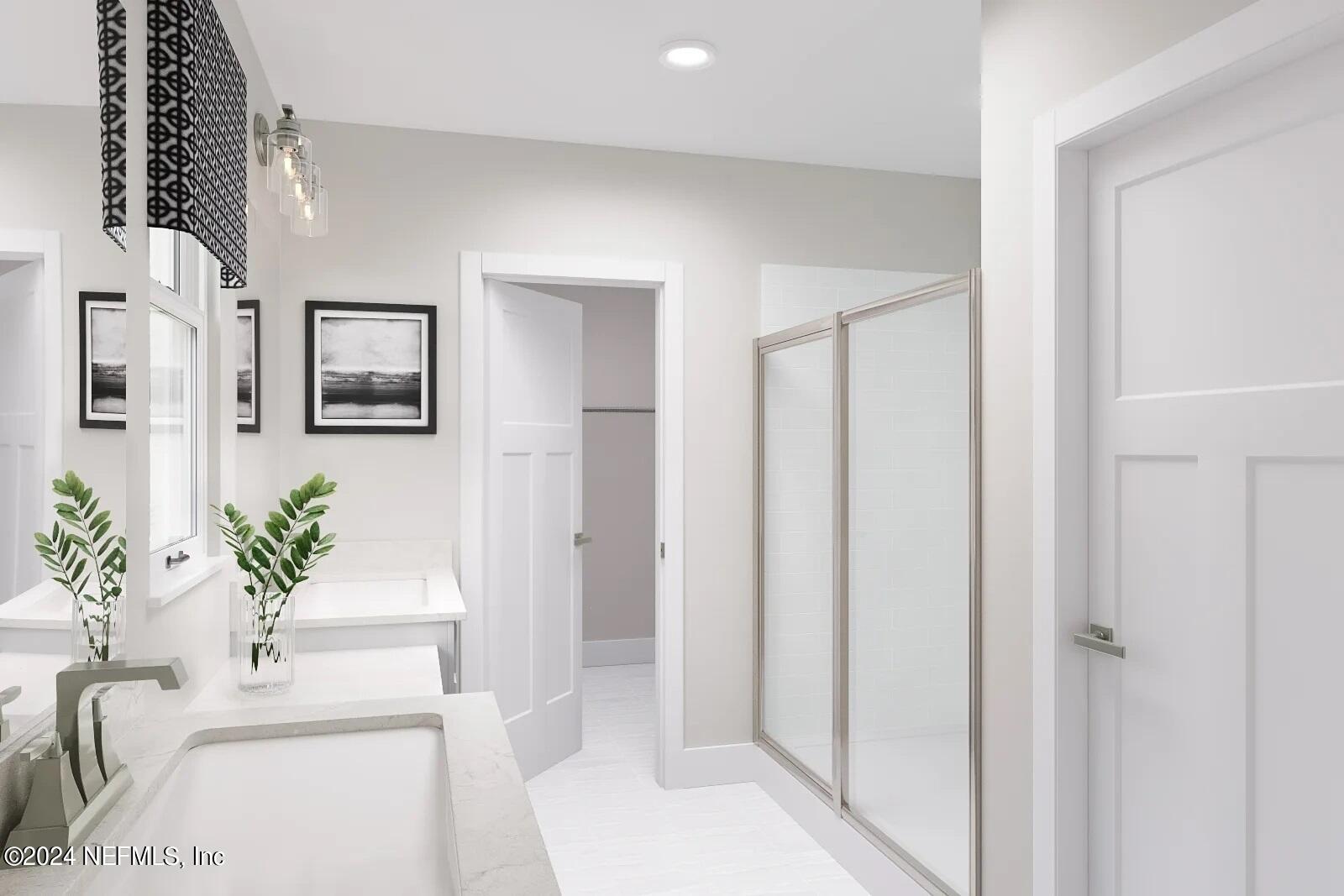 32 Yellowstone Drive, Unit 1001C St. Augustine, FL 32092 - Photo 6 of 6 a bathroom with a tub shower and a mirror