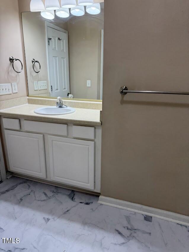 4429 Log Cabin Drive Raleigh, NC 27616 - Photo 20 of 27 a bathroom with a sink and a mirror