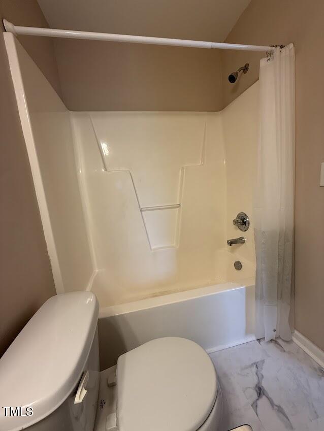 4429 Log Cabin Drive Raleigh, NC 27616 - Photo 24 of 27 a white toilet and tub next to a bathroom sink