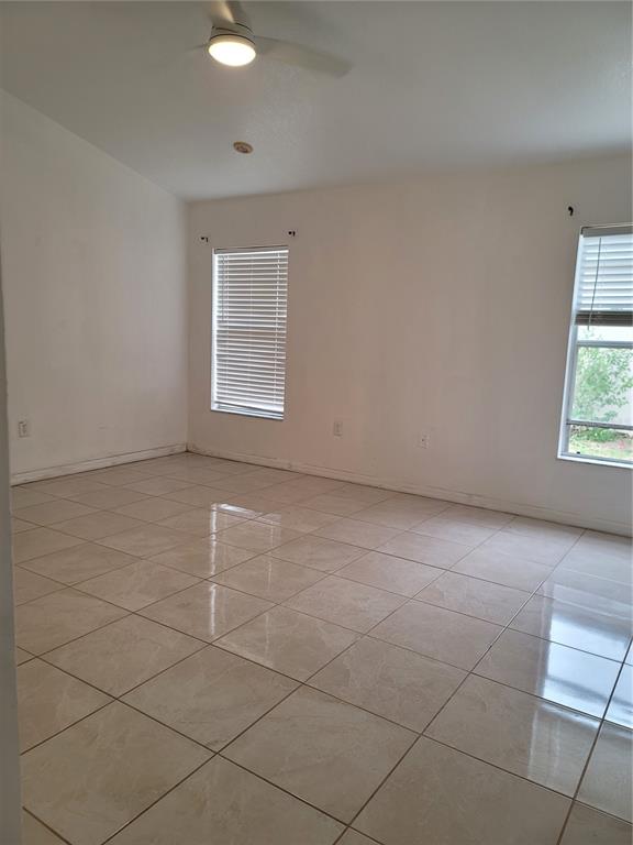 601 Astor Drive Haines City, FL 33844 - Photo 11 of 18 an empty room with a white door and a window