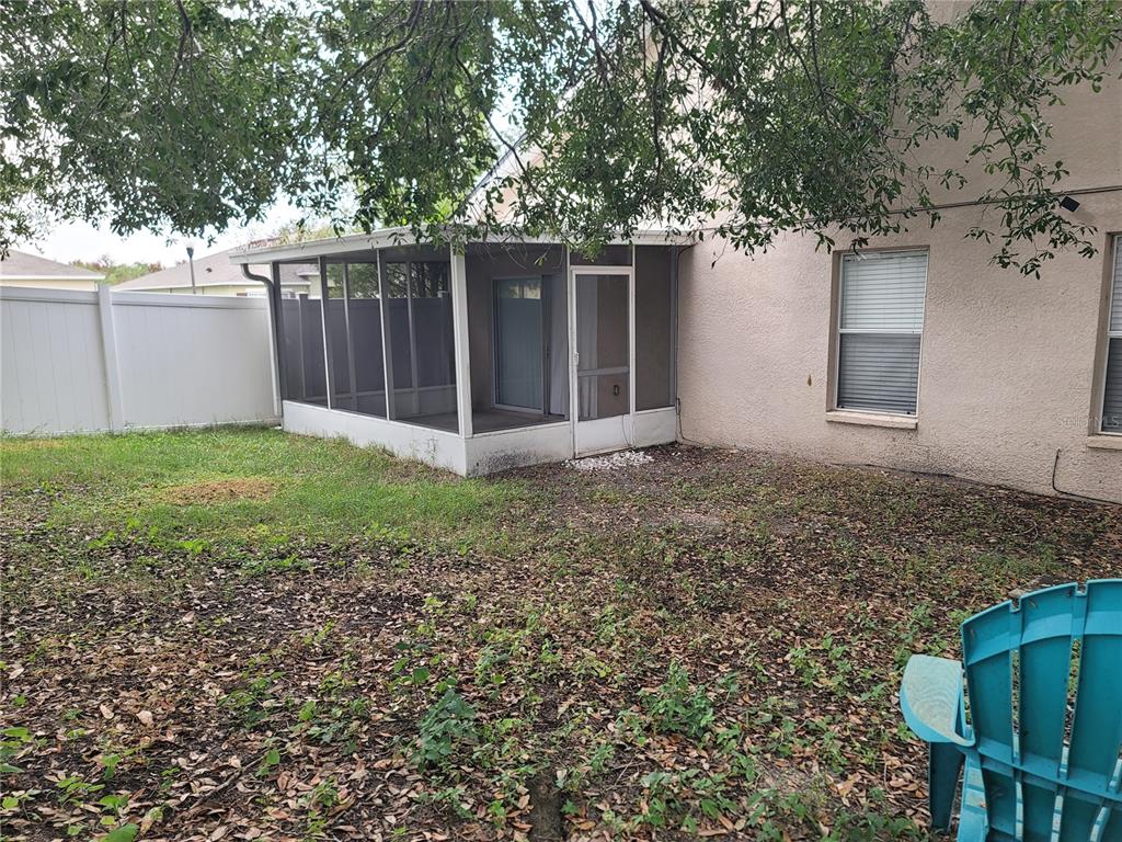 601 Astor Drive Haines City, FL 33844 - Photo 18 of 18 a view of a house with a yard