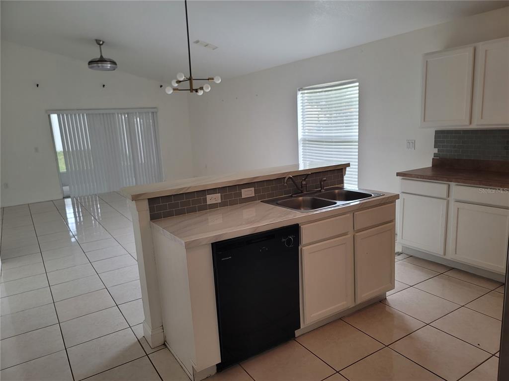 601 Astor Drive Haines City, FL 33844 - Photo 7 of 18 a kitchen with a sink and cabinets