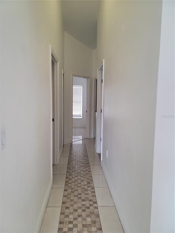 601 Astor Drive Haines City, FL 33844 - Photo 9 of 18 a view of a hallway with a white walls