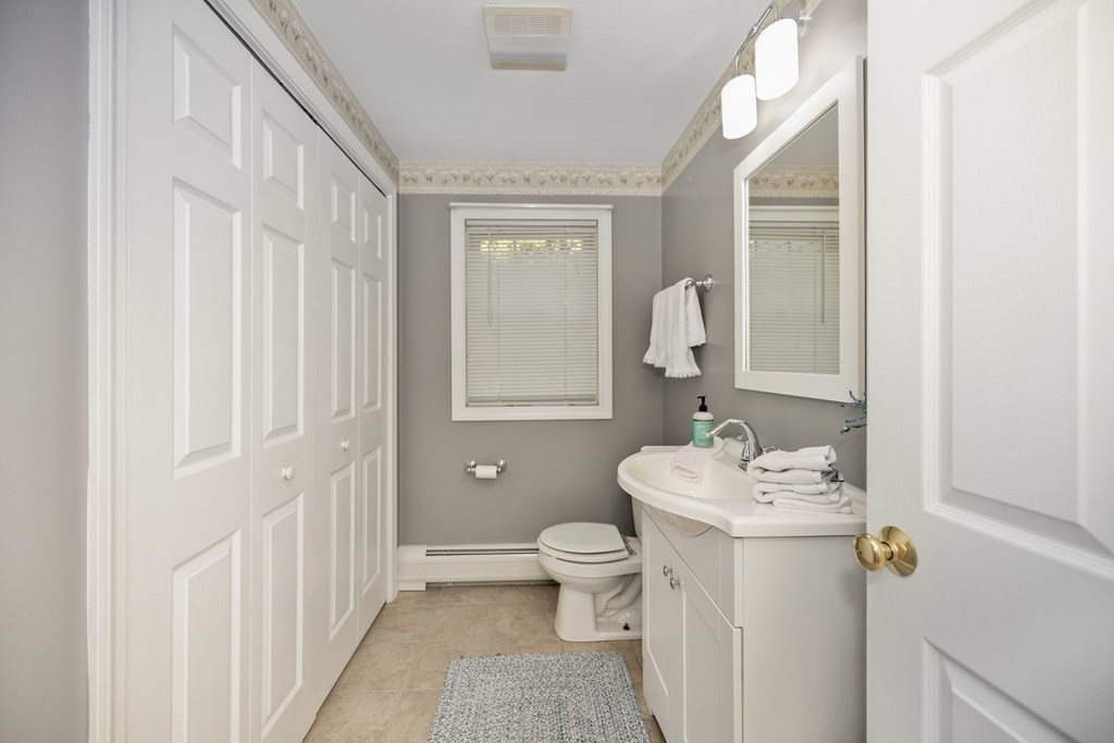 304 Mill Road Fairhaven, MA 02719 - Photo 15 of 35 a bathroom with a sink toilet and shower