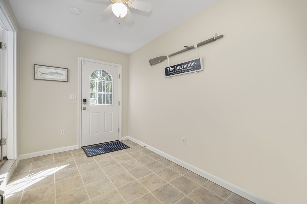 304 Mill Road Fairhaven, MA 02719 - Photo 16 of 35 an empty room with windows and ceiling fan