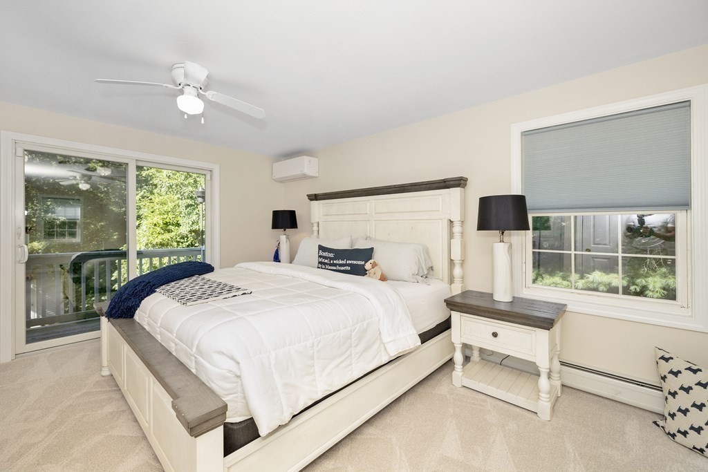 304 Mill Road Fairhaven, MA 02719 - Photo 19 of 35 a bedroom with a bed and a large window