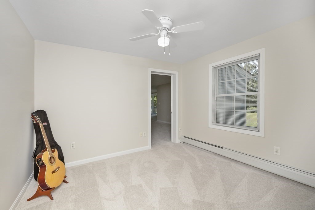 304 Mill Road Fairhaven, MA 02719 - Photo 21 of 35 an empty room with windows and ceiling fan