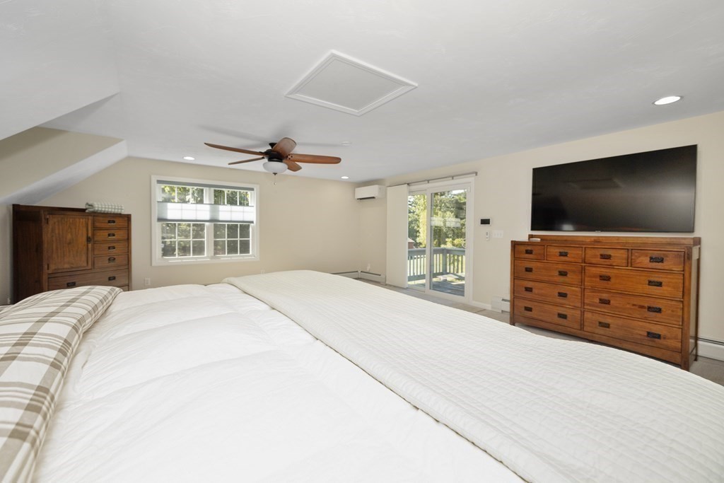 304 Mill Road Fairhaven, MA 02719 - Photo 24 of 35 a bedroom with a bed and a flat screen tv