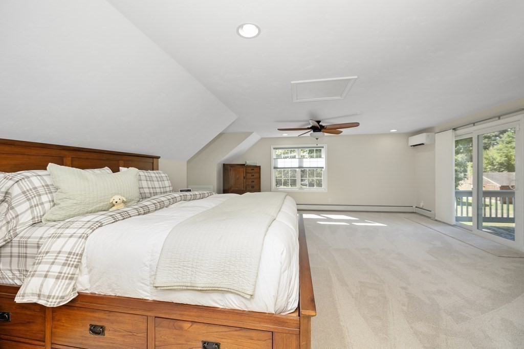304 Mill Road Fairhaven, MA 02719 - Photo 25 of 35 a bedroom with a large bed and a window