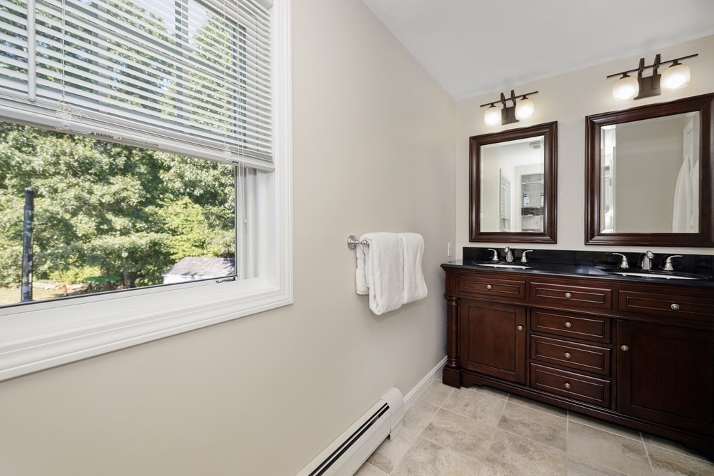 304 Mill Road Fairhaven, MA 02719 - Photo 28 of 35 a room with a bed and a mirror on dresser