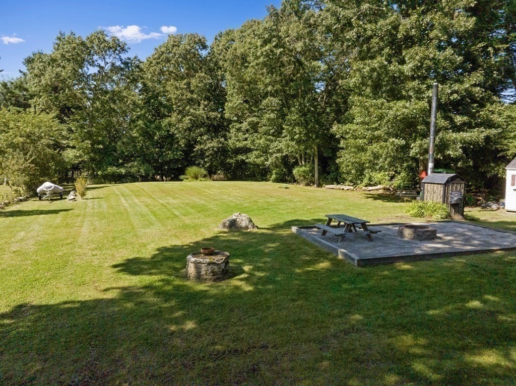 304 Mill Road Fairhaven, MA 02719 - Photo 29 of 35 a view of yard with swimming pool and trees in the background