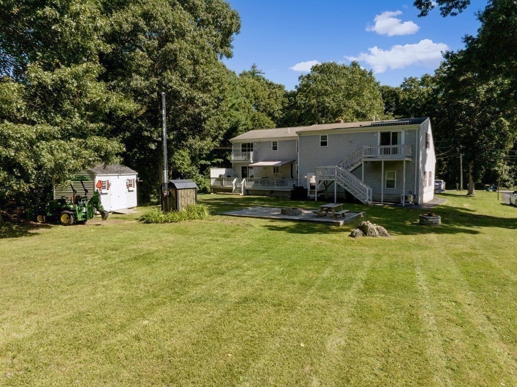 304 Mill Road Fairhaven, MA 02719 - Photo 30 of 35 a view of a house with pool and a yard