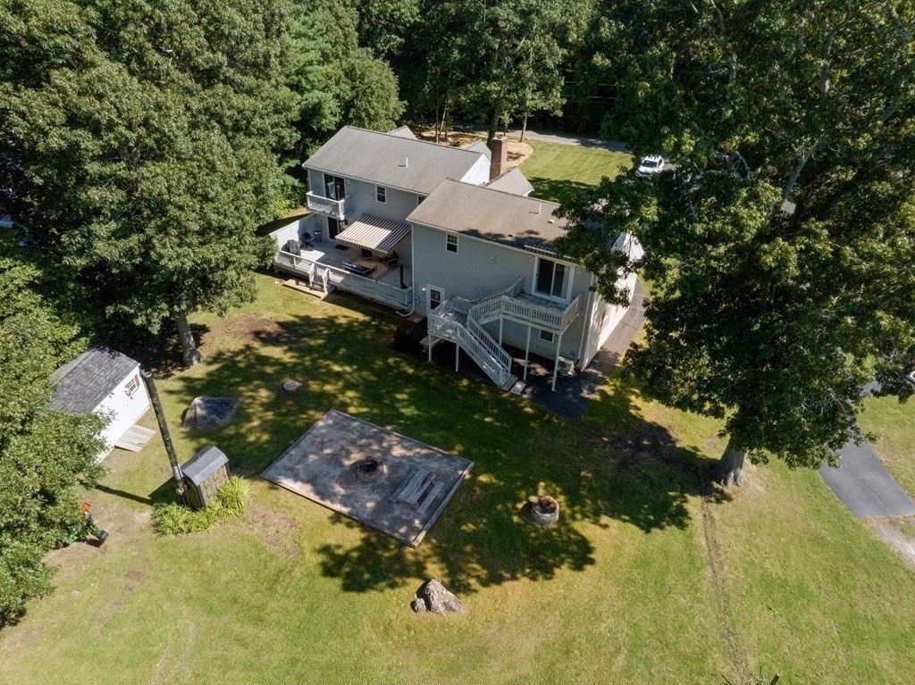 304 Mill Road Fairhaven, MA 02719 - Photo 32 of 35 an aerial view of a house with a yard and trees