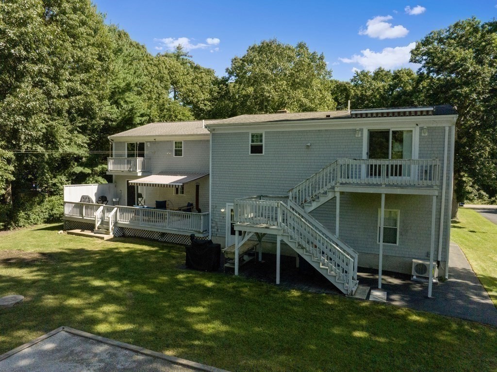 304 Mill Road Fairhaven, MA 02719 - Photo 33 of 35 a view of a house with a yard and sitting area
