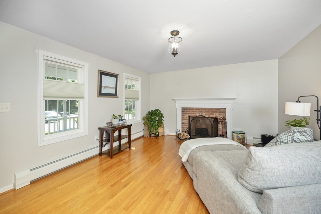 304 Mill Road Fairhaven, MA 02719 - Photo 6 of 35 a living room with furniture and a fireplace