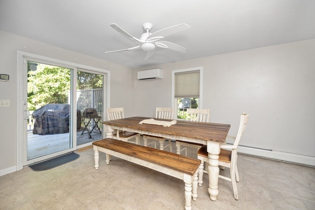 304 Mill Road Fairhaven, MA 02719 - Photo 10 of 35 a living room with a bed and a table