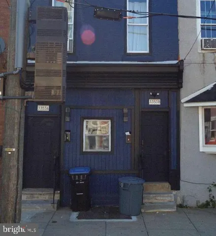 a kitchen with cabinets stainless steel appliances and wooden cabinets