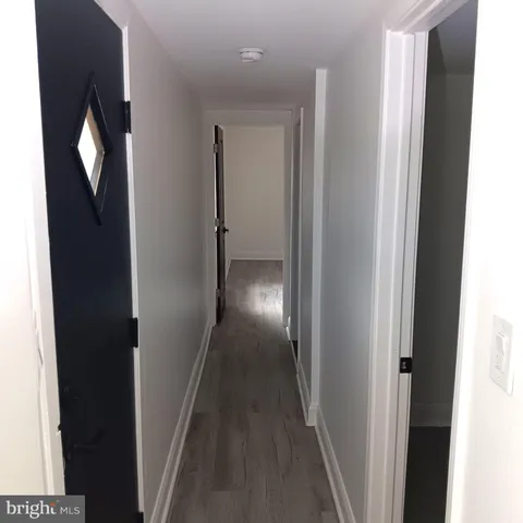 an empty room with wooden floor