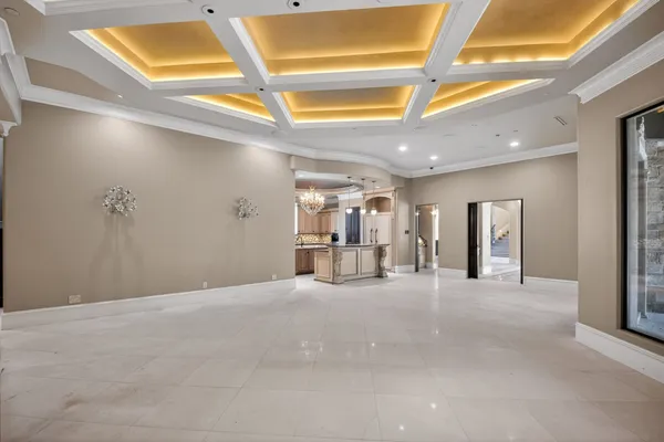 a big room with windows and a fireplace